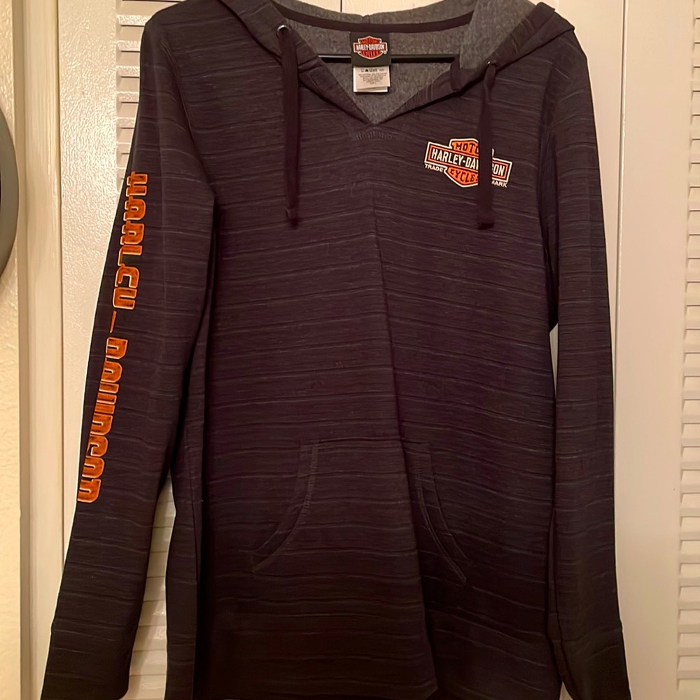 Black and gold Harley Davidson long sleeve hoodie with front pockets size large.